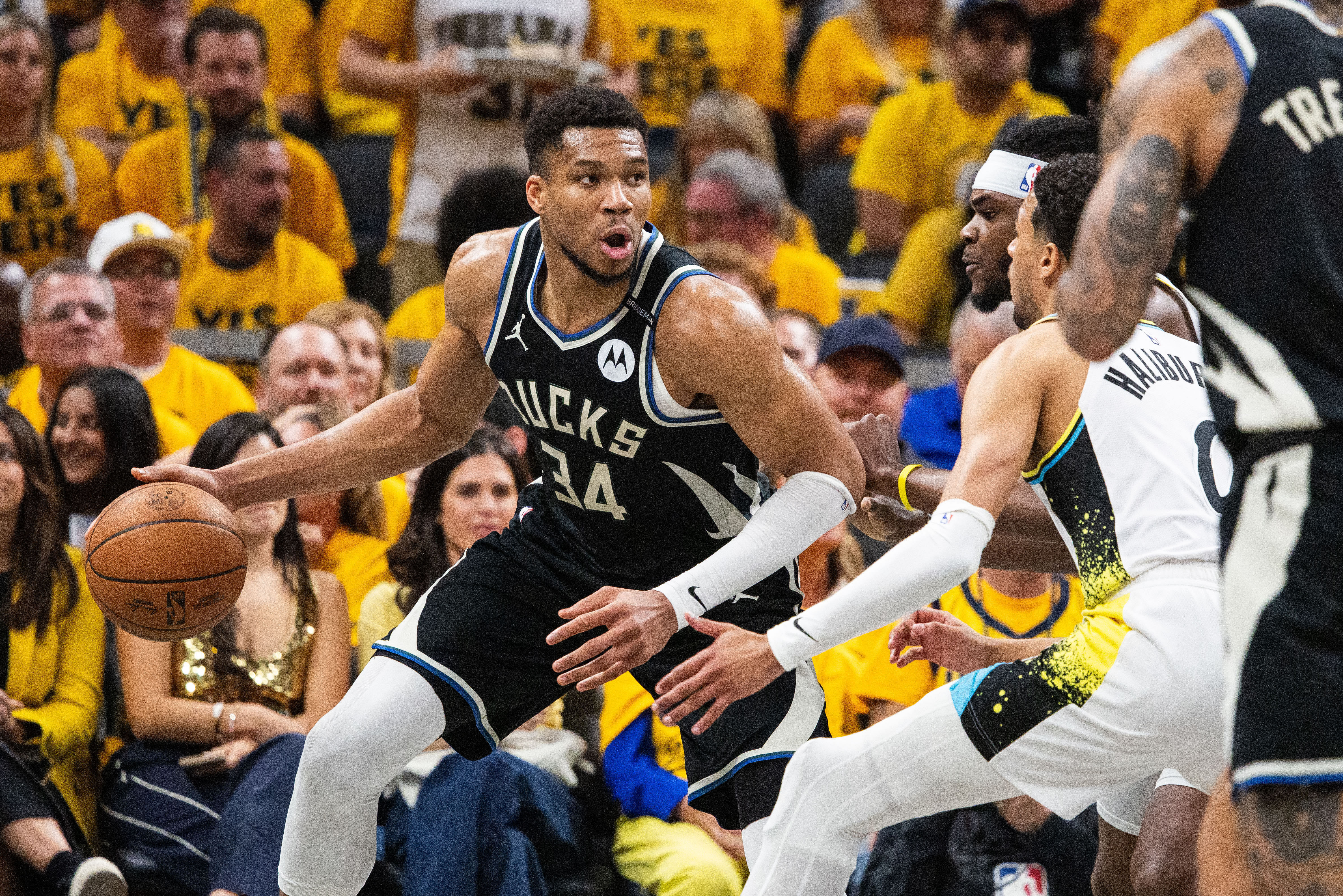Milwaukee Bucks forward Giannis Antetokounmpo (34) dribbles the ball while Indiana Pacers forward Jarace Walker (5) defends during game five of the first round for the 2024 NBA Playoffs at Gainbridge Fieldhouse. - Source: Imagn